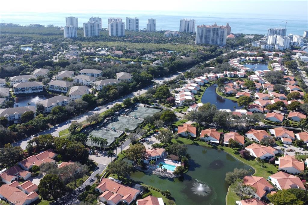 796 Reef Point Circle Naples, FL 34108 - Photo 35 of 37 an aerial view of a city with lots of residential buildings
