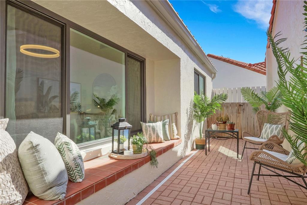 796 Reef Point Circle Naples, FL 34108 - Photo 5 of 37 a view of a two chairs in the balcony