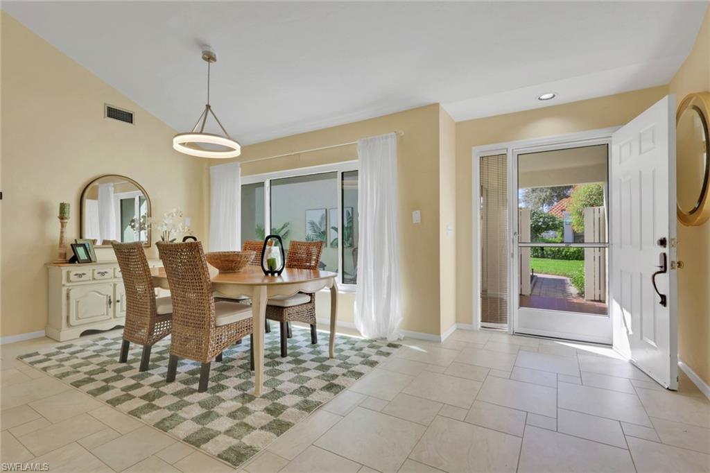 796 Reef Point Circle Naples, FL 34108 - Photo 6 of 37 a view of a dining room with furniture window and outside view