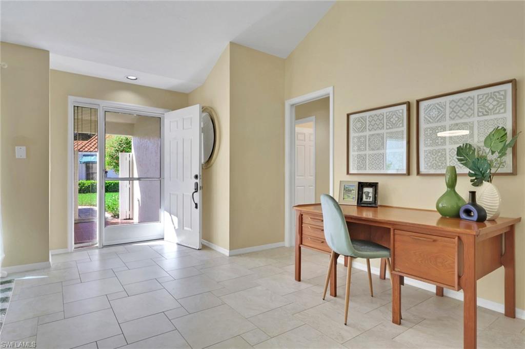 796 Reef Point Circle Naples, FL 34108 - Photo 7 of 37 a view of a dining room with furniture and a potted plant