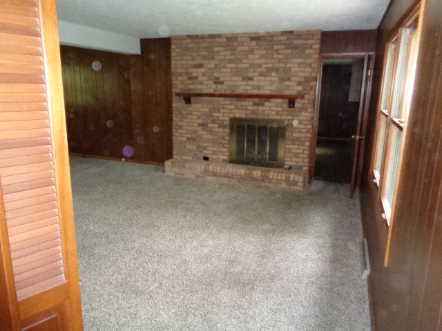 4965 Brigadoon Road Rockford, IL 61107 - Photo 13 of 13 a view of empty room with a fireplace