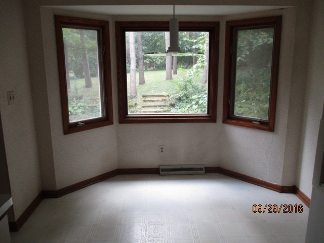 4965 Brigadoon Road Rockford, IL 61107 - Photo 6 of 13 an empty room with a window
