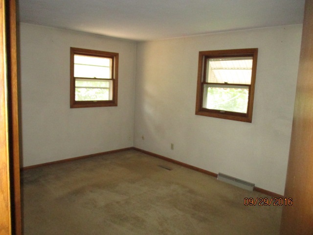 4965 Brigadoon Road Rockford, IL 61107 - Photo 10 of 13 an empty room with a window