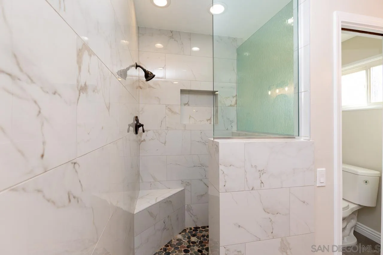 2922 Olive View Road Alpine, CA 91901 - Photo 19 of 34 a bathroom with a sink a toilet and shower