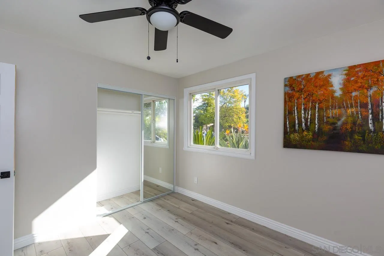 2922 Olive View Road Alpine, CA 91901 - Photo 21 of 34 an empty room with windows and ceiling fan