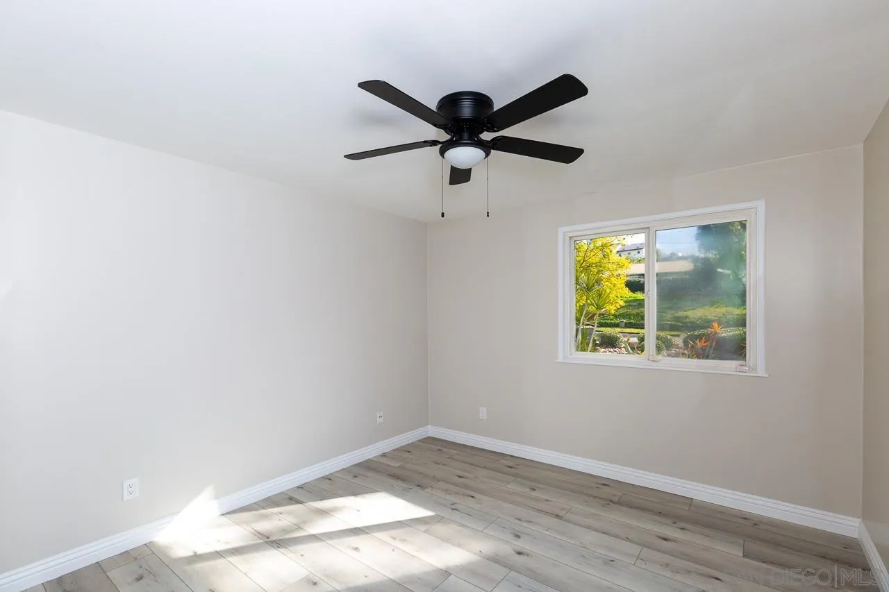 2922 Olive View Road Alpine, CA 91901 - Photo 23 of 34 a view of empty room with wooden floor and fan
