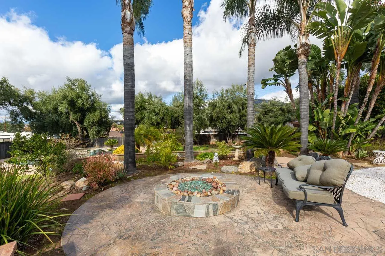 2922 Olive View Road Alpine, CA 91901 - Photo 28 of 34 a backyard of a house with lawn chairs plants and outdoor seating