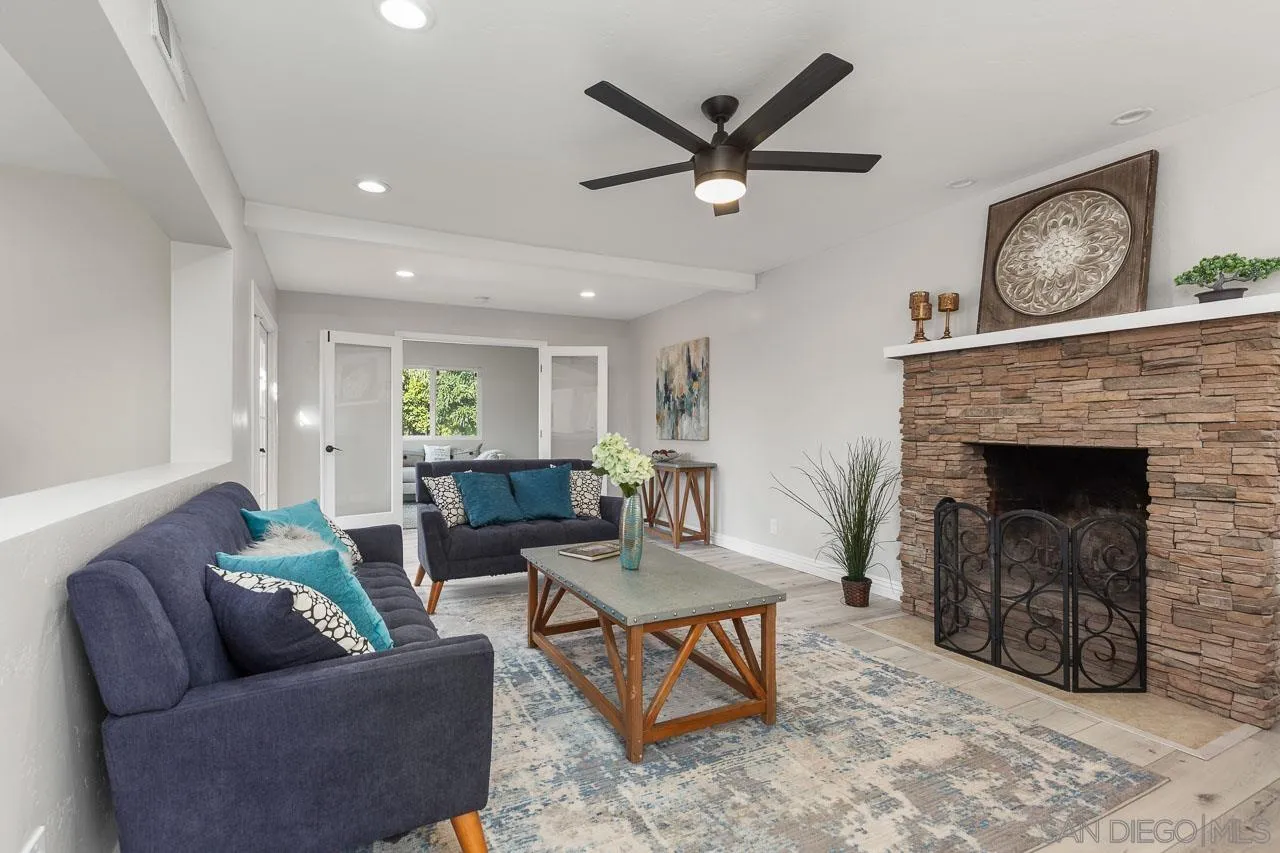 2922 Olive View Road Alpine, CA 91901 - Photo 9 of 34 a living room with furniture and a fireplace