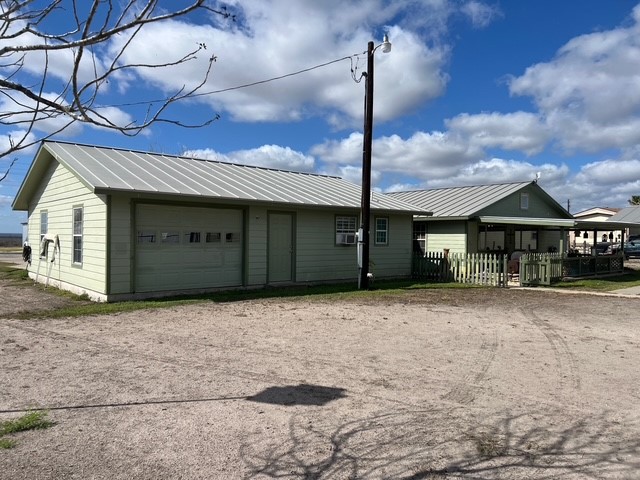 104 Jonathan Street Three Rivers, TX 78071 - Photo 14 of 17 a front view of a house with a yard
