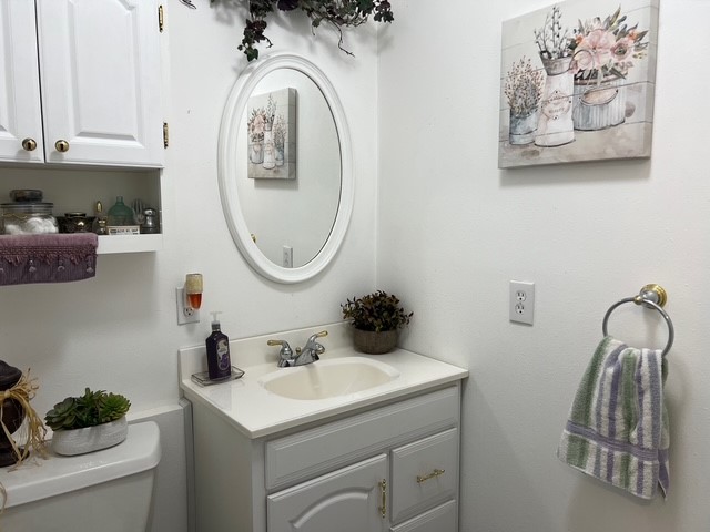 104 Jonathan Street Three Rivers, TX 78071 - Photo 9 of 17 a bathroom with a sink and a mirror