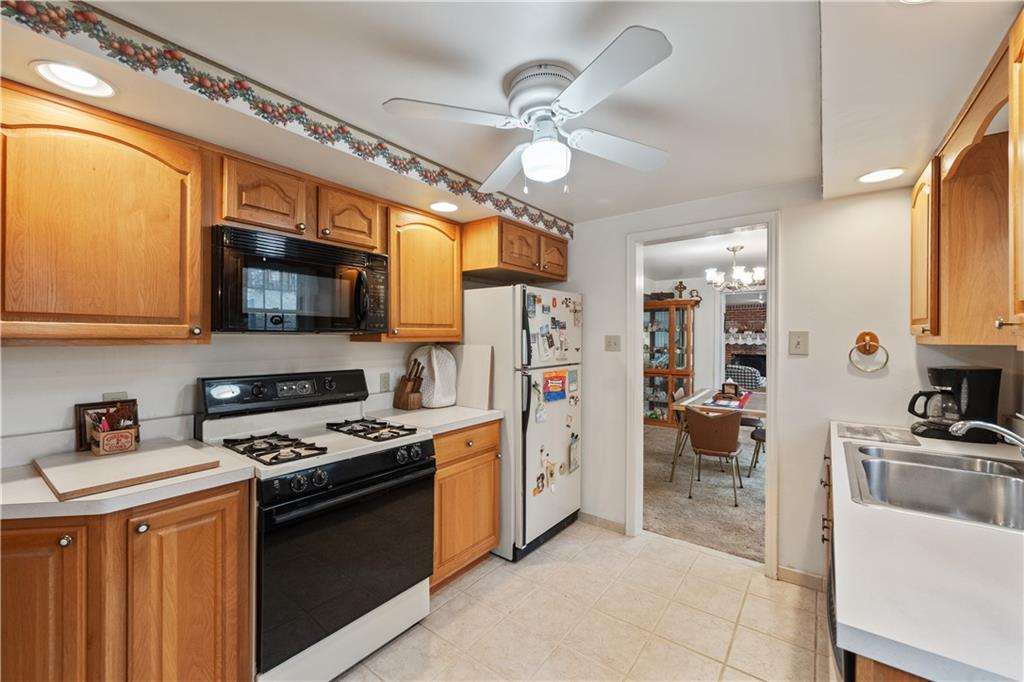116 Virginia Road Pittsburgh, PA 15237 - Photo 14 of 29 a kitchen with stainless steel appliances granite countertop a stove cabinets and a refrigerator