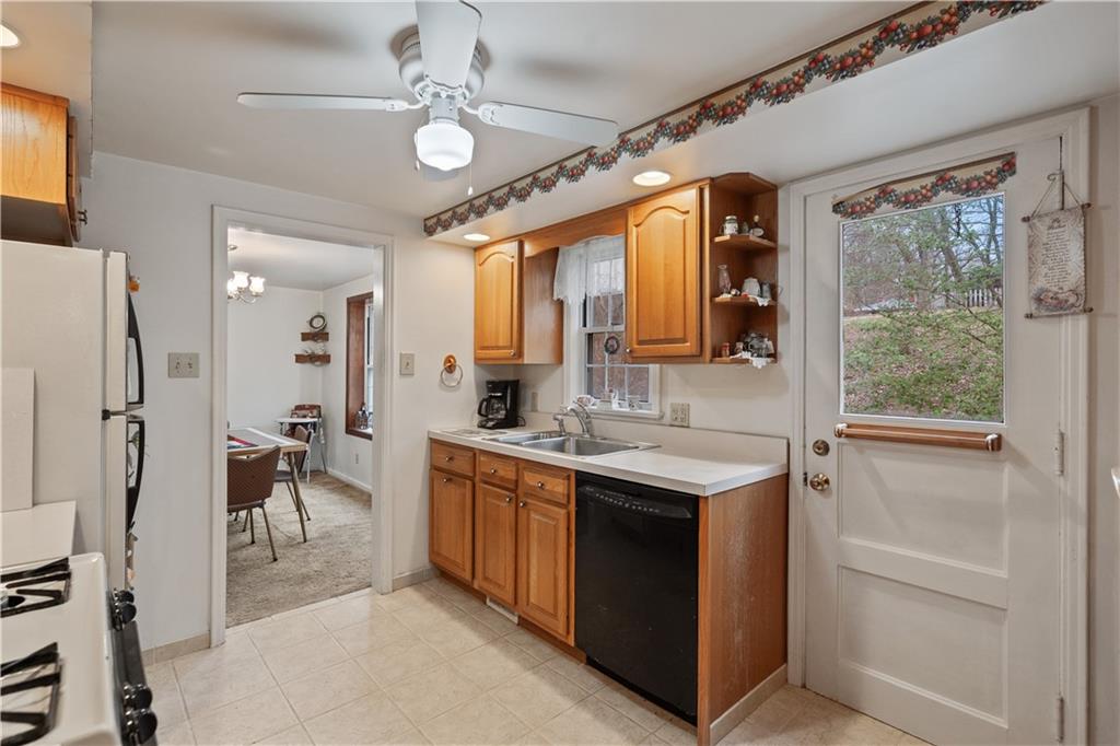 116 Virginia Road Pittsburgh, PA 15237 - Photo 15 of 29 a view of a kitchen with a sink a refrigerator and a stove