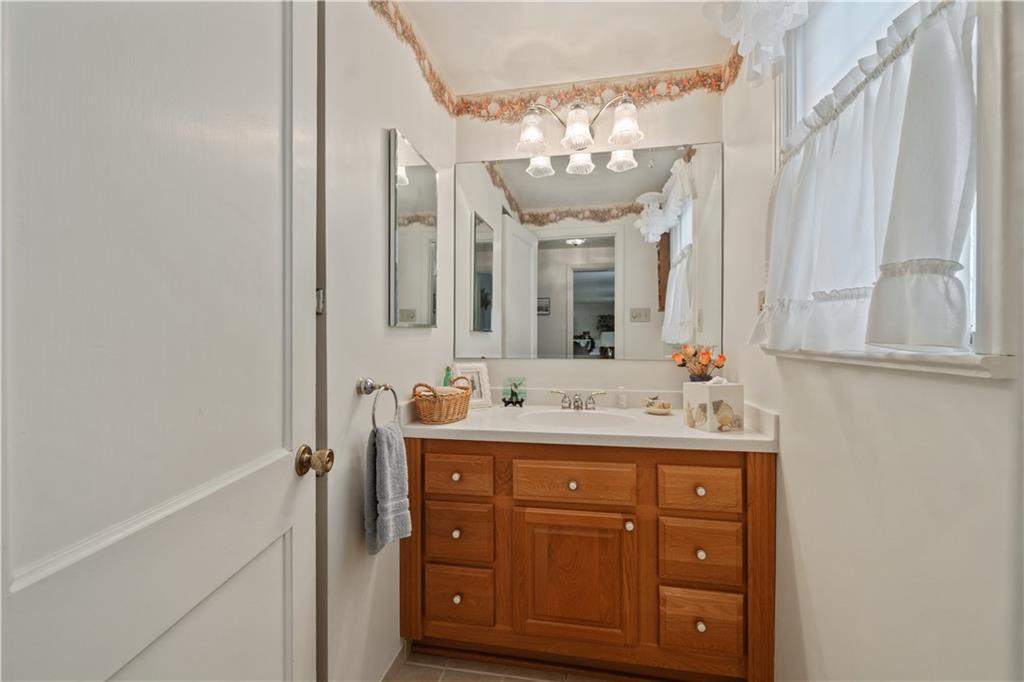 116 Virginia Road Pittsburgh, PA 15237 - Photo 18 of 29 a bathroom with a double vanity sink and a mirror