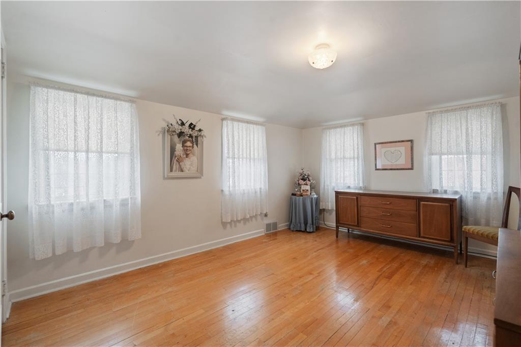 116 Virginia Road Pittsburgh, PA 15237 - Photo 19 of 29 a view of room with window and wooden floor