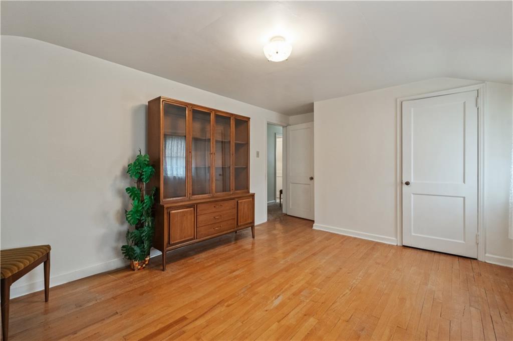116 Virginia Road Pittsburgh, PA 15237 - Photo 20 of 29 a view of an empty room with wooden floor and a window