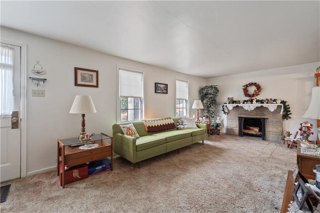116 Virginia Road Pittsburgh, PA 15237 - Photo 3 of 29 a living room with furniture and a fireplace