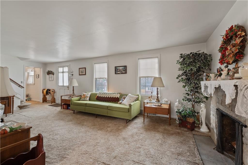116 Virginia Road Pittsburgh, PA 15237 - Photo 4 of 29 a living room with furniture and a fireplace