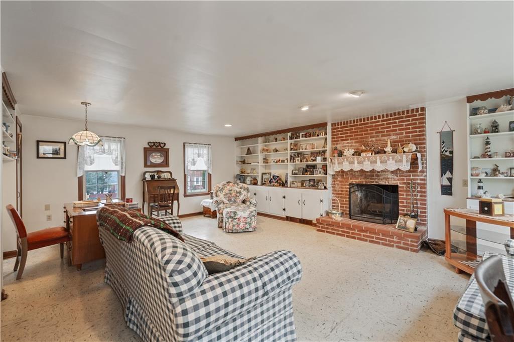 116 Virginia Road Pittsburgh, PA 15237 - Photo 9 of 29 a living room with furniture and a fireplace