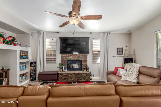 a bedroom with furniture and a flat screen tv