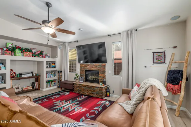a living room with furniture and a rug
