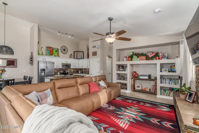 a view of a dining room with furniture wooden floor and chandelier