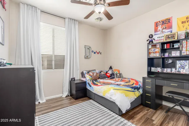 a bedroom with bed and a book shelf