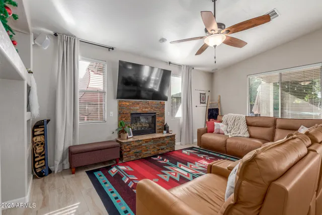a living room with furniture and a fireplace
