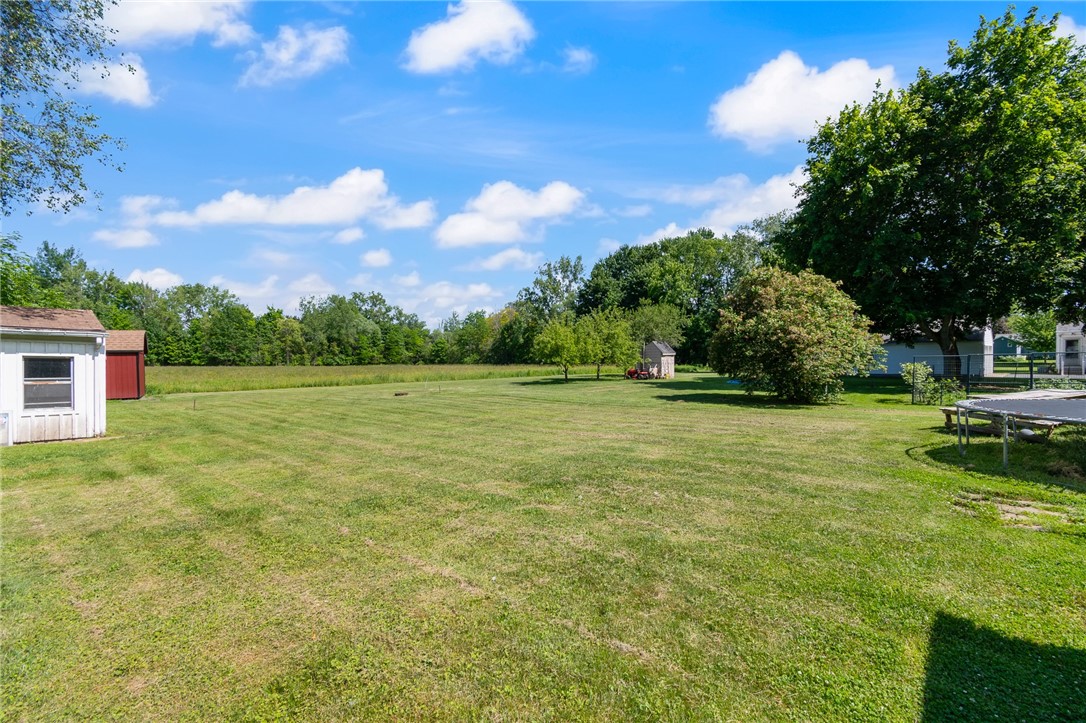 6170 Locust Street Williamson, NY 14589 - Photo 4 of 26 Great space out back to enjoy entertaining! This h