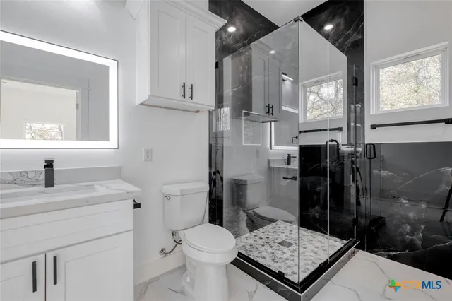 a bathroom with a bathtub and a window