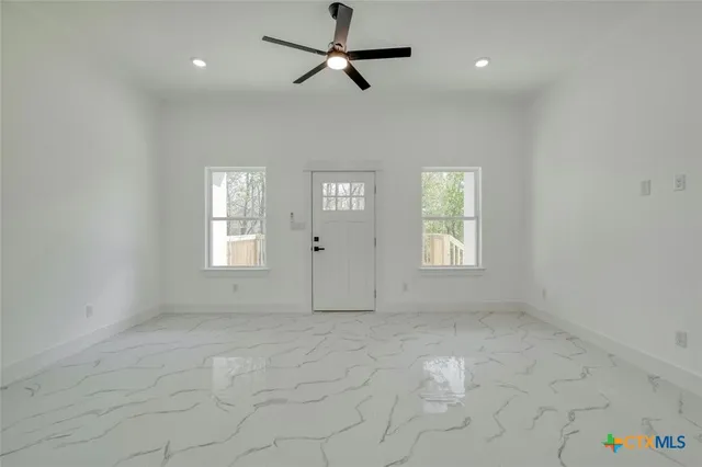 a view of an empty room with a window