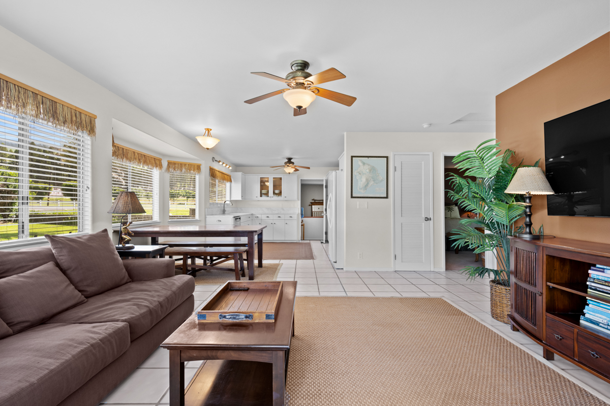 66-1685 Kohala Mountain Road Kamuela, HI 96743 - Photo 4 of 26 a living room with furniture a flat screen tv and a window