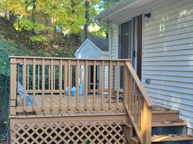 a view of house with wooden fence