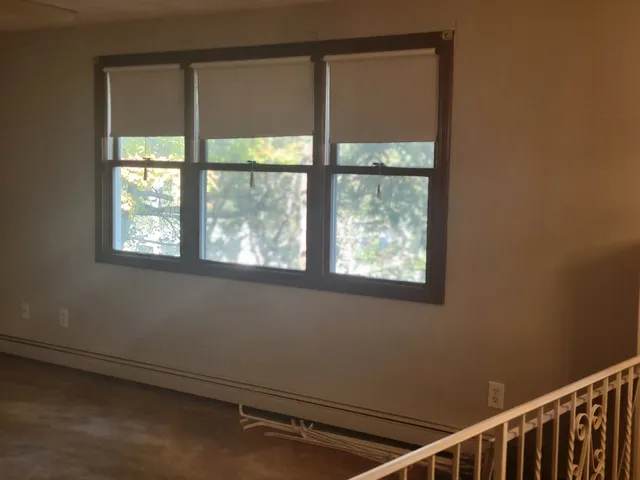 a view of a room that has a window in it