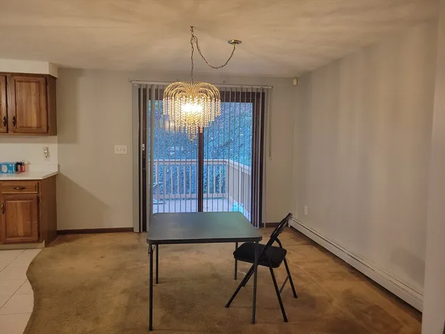 a workspace room with furniture and wooden floor