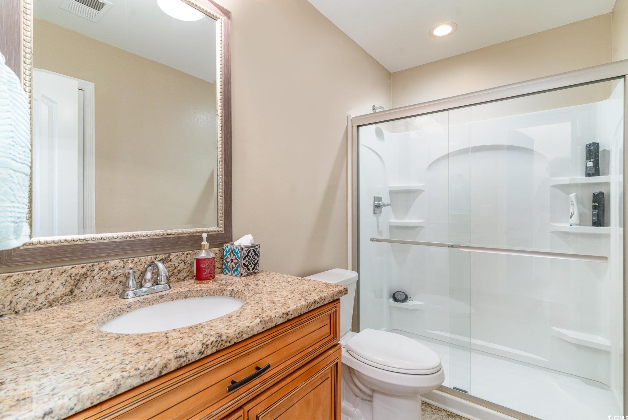 625 Seth Lane Longs, SC 29568 - Photo 20 of 34 Bathroom with vanity, toilet, and walk in shower
