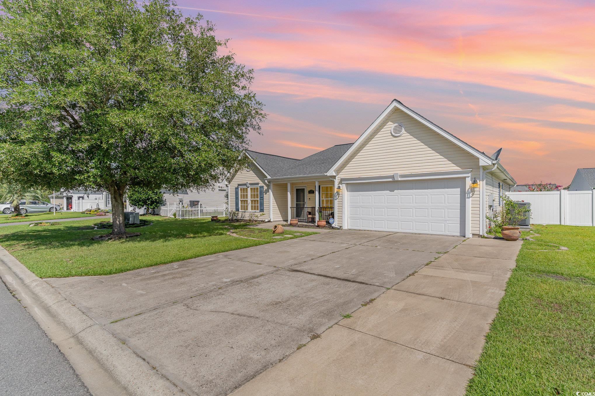 625 Seth Lane Longs, SC 29568 - Photo 2 of 34 Ranch-style house featuring a garage and a yard