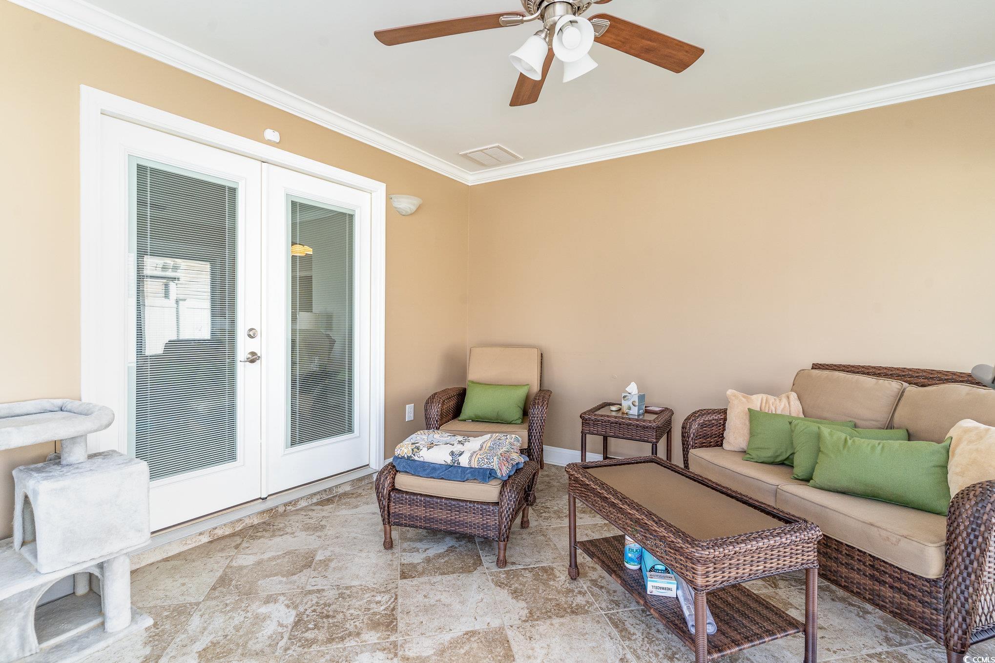 625 Seth Lane Longs, SC 29568 - Photo 23 of 34 Living area with crown molding, french doors, ligh