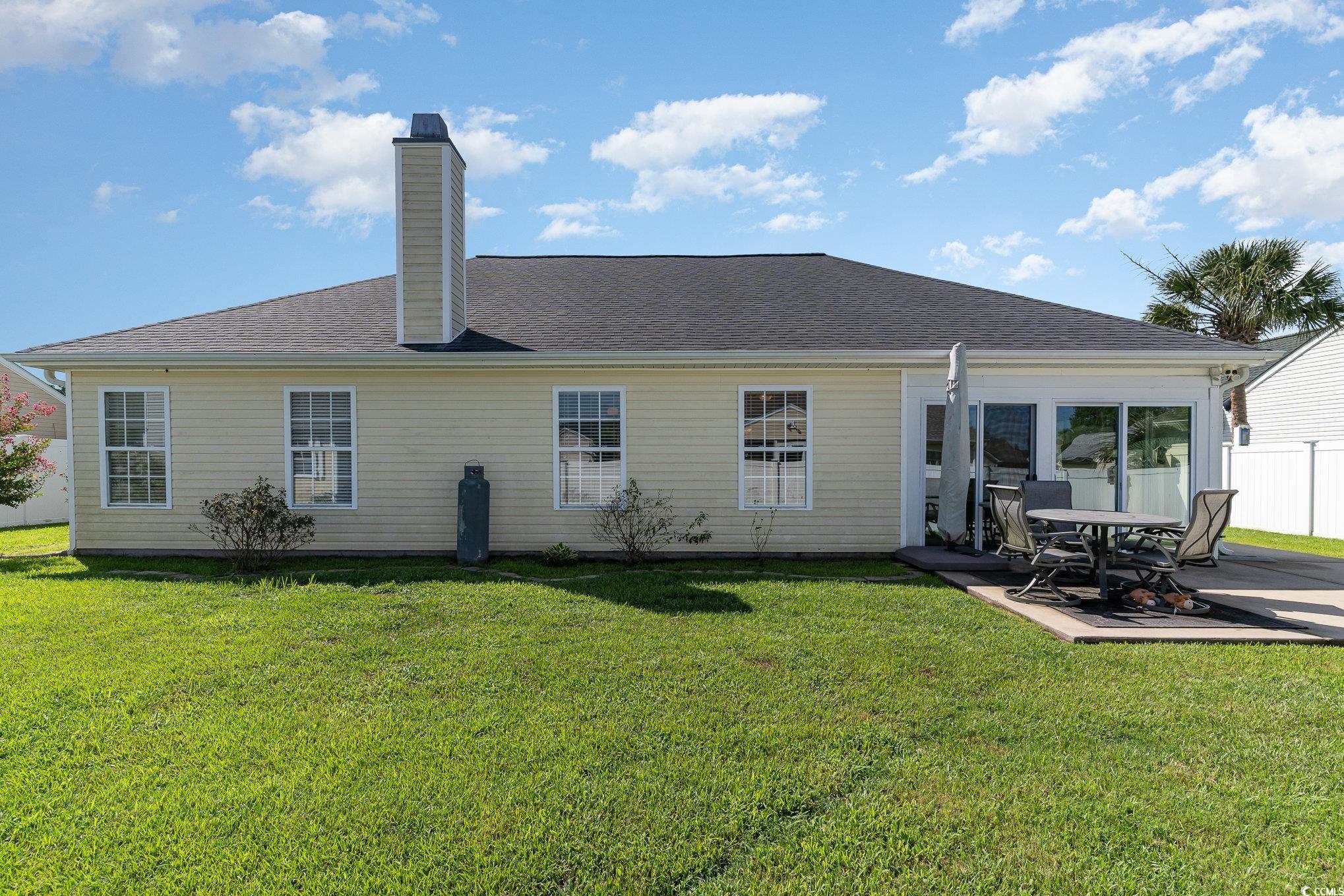 625 Seth Lane Longs, SC 29568 - Photo 29 of 34 Back of property featuring a patio area and a lawn