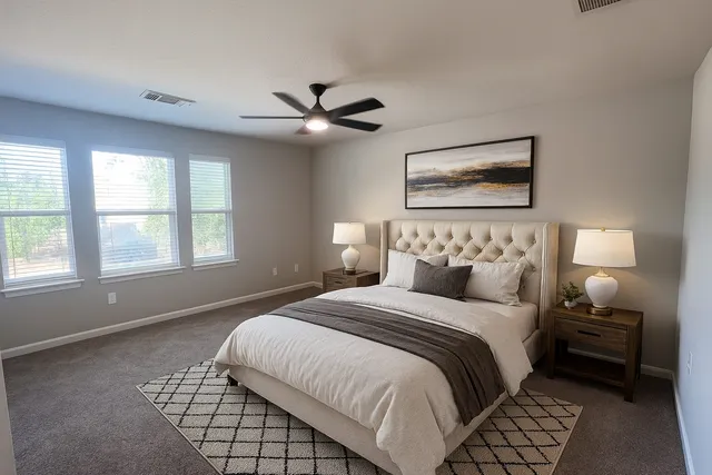 a bedroom with bed and window