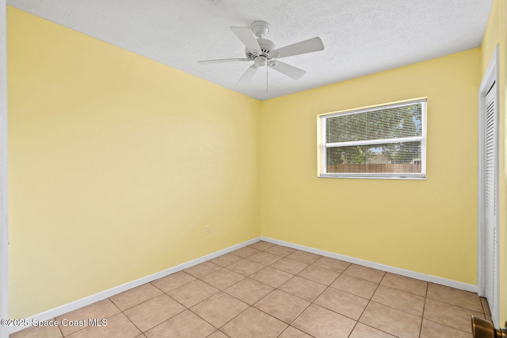 2902 Emory Street Melbourne, FL 32901 - Photo 15 of 46 a view of a big room with windows