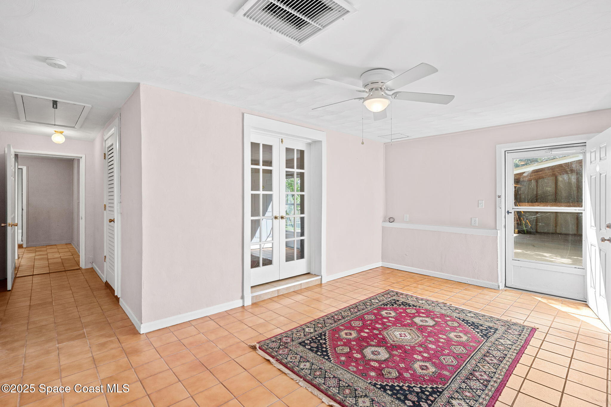 2902 Emory Street Melbourne, FL 32901 - Photo 17 of 46 a view of an empty room with a rug