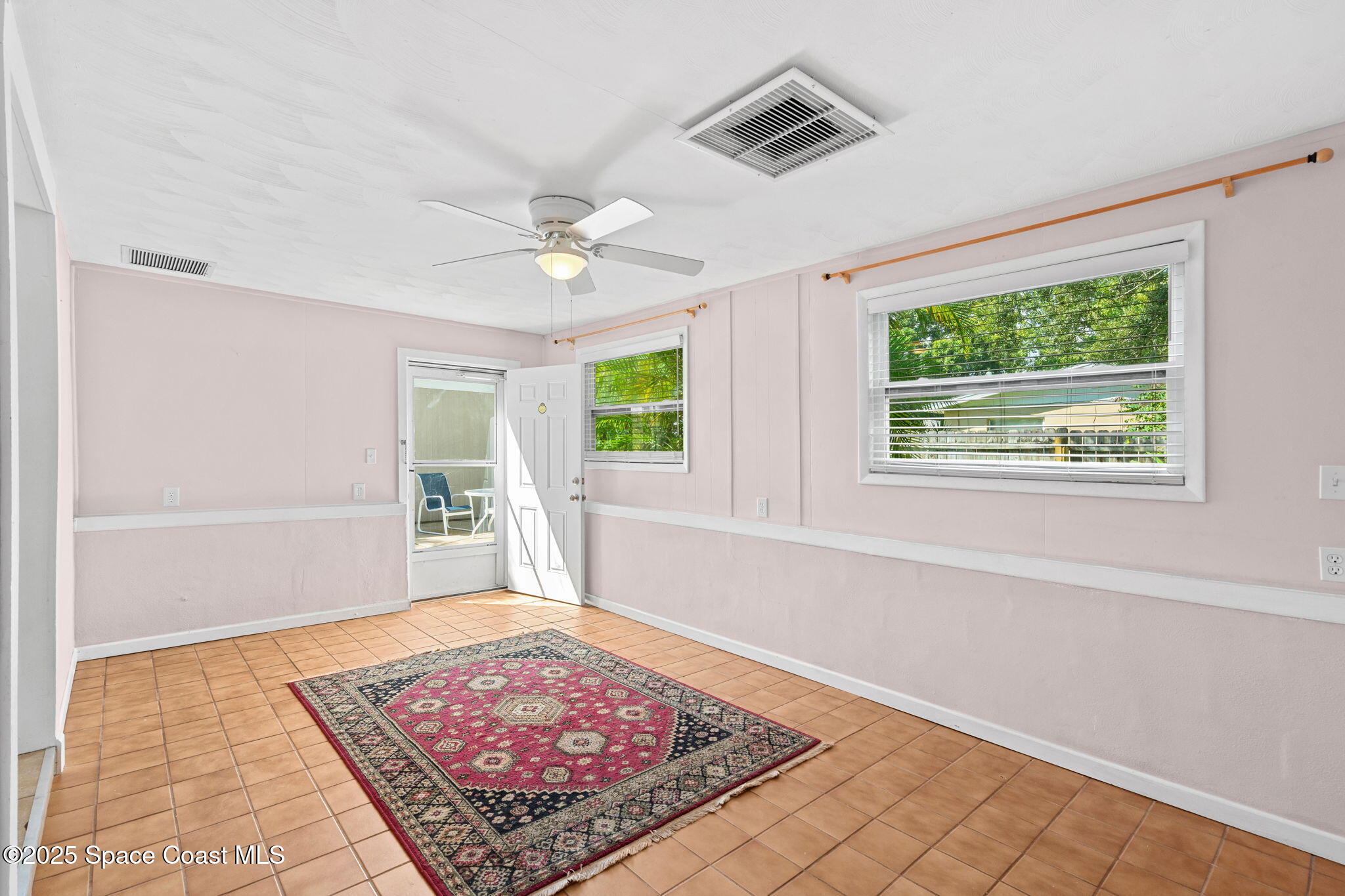 2902 Emory Street Melbourne, FL 32901 - Photo 19 of 46 a living room with furniture and a rug