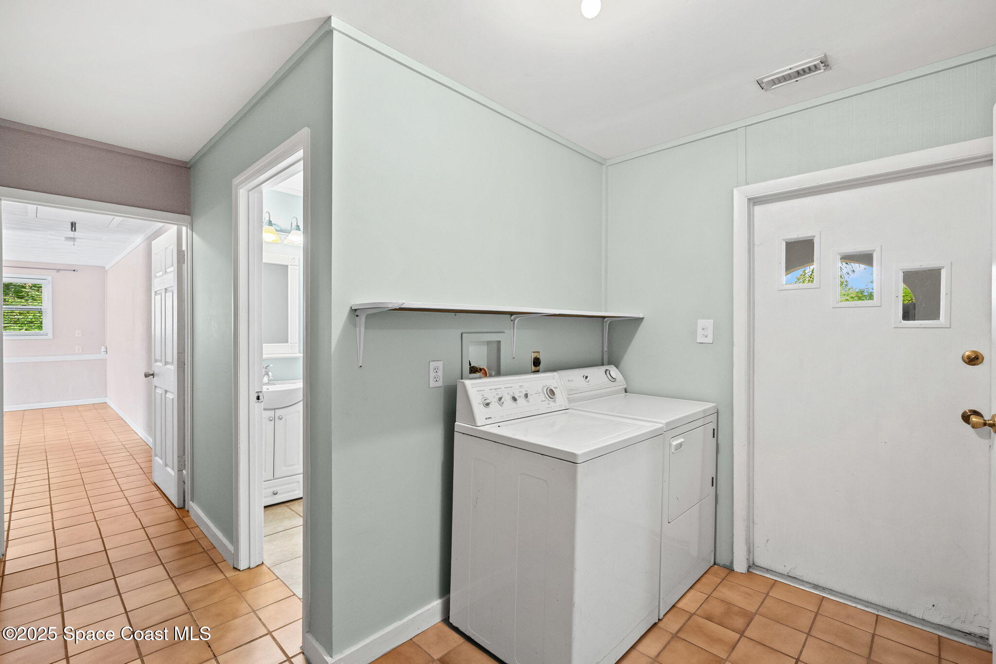 2902 Emory Street Melbourne, FL 32901 - Photo 21 of 46 a view of a storage & utility room with a washer dryer