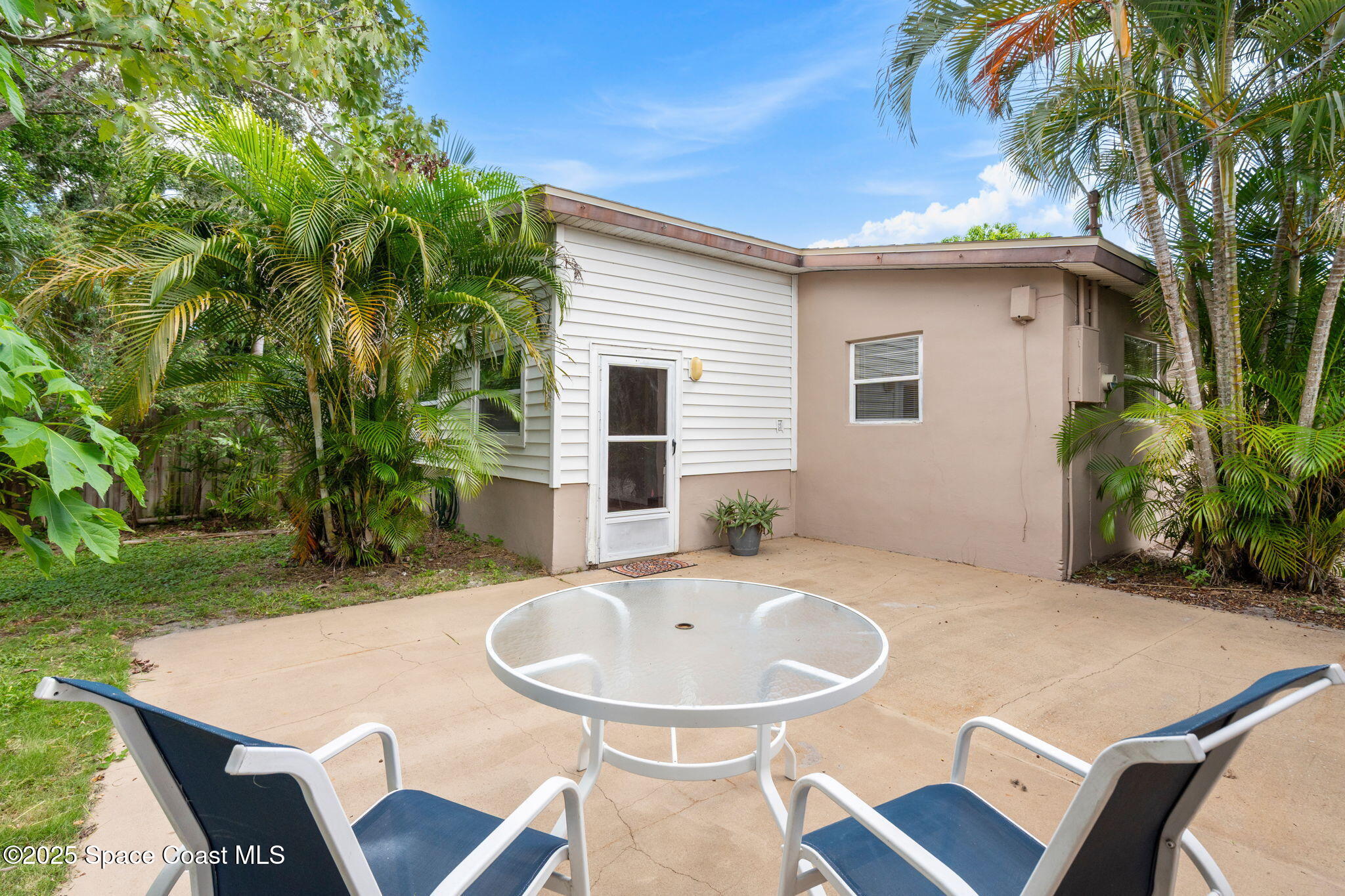 2902 Emory Street Melbourne, FL 32901 - Photo 25 of 46 a view of a table and chairs in patio