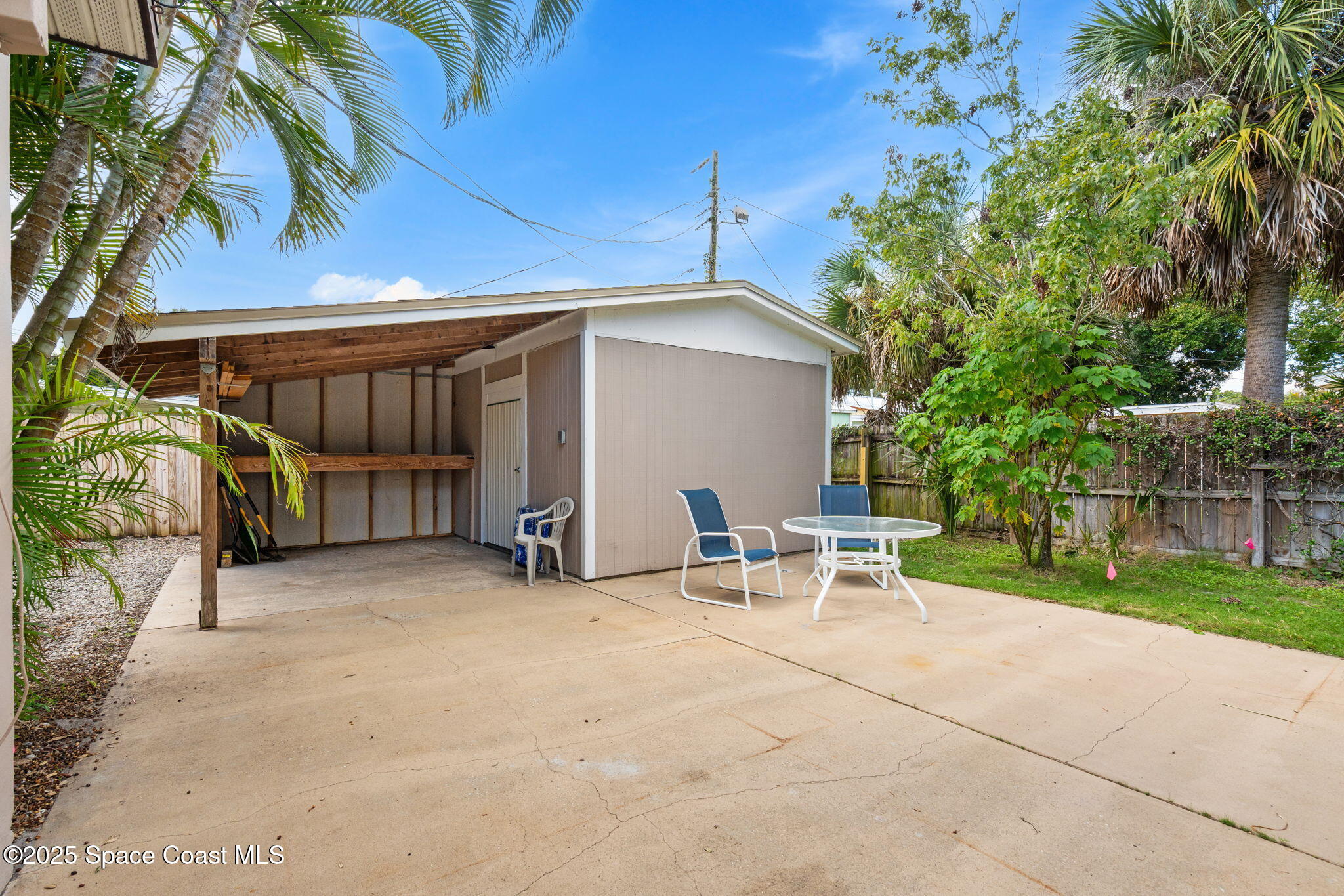2902 Emory Street Melbourne, FL 32901 - Photo 27 of 46 a view of backyard with outdoor seating and plants