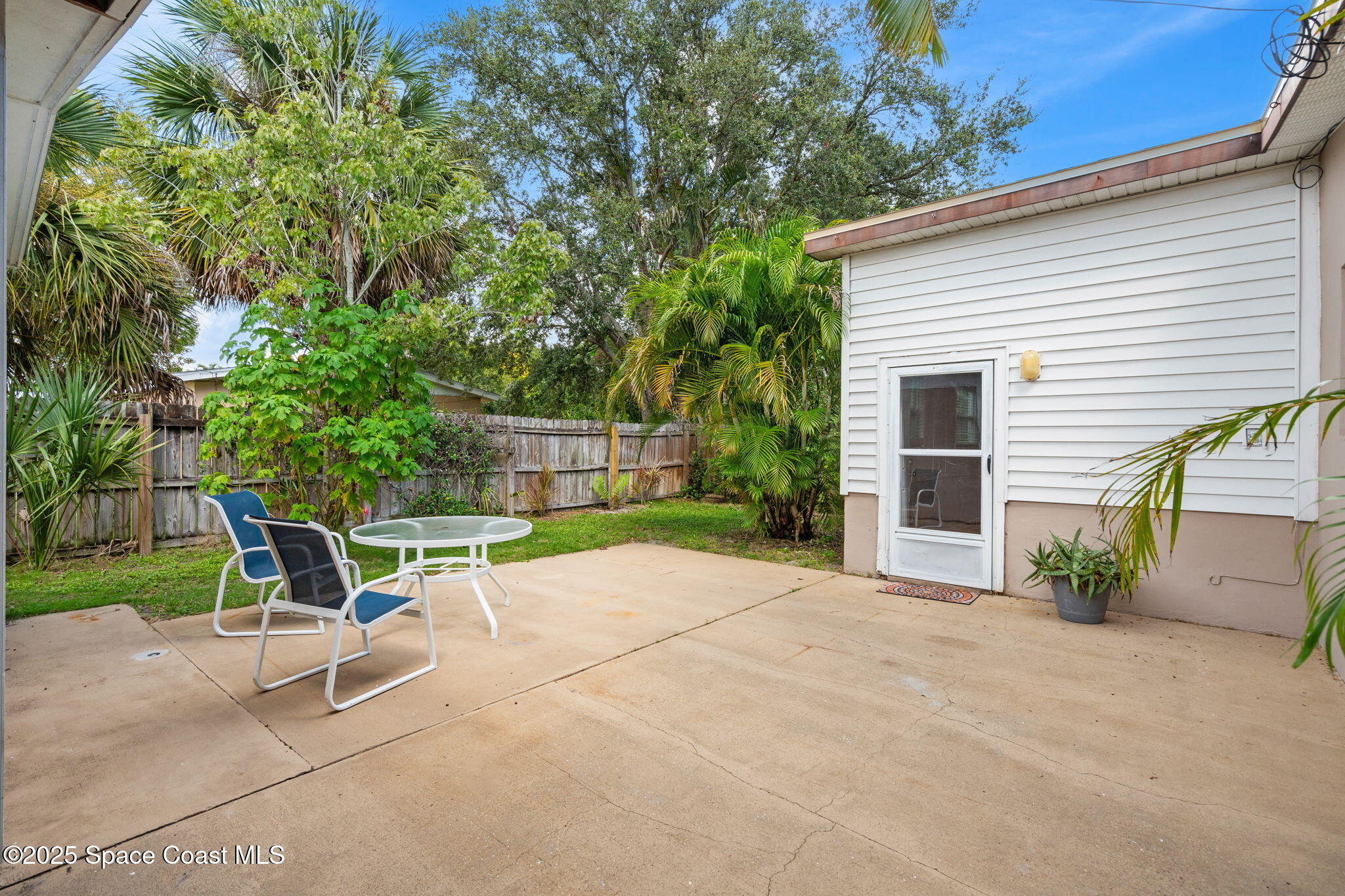2902 Emory Street Melbourne, FL 32901 - Photo 29 of 46 a bench sitting in middle of a yard