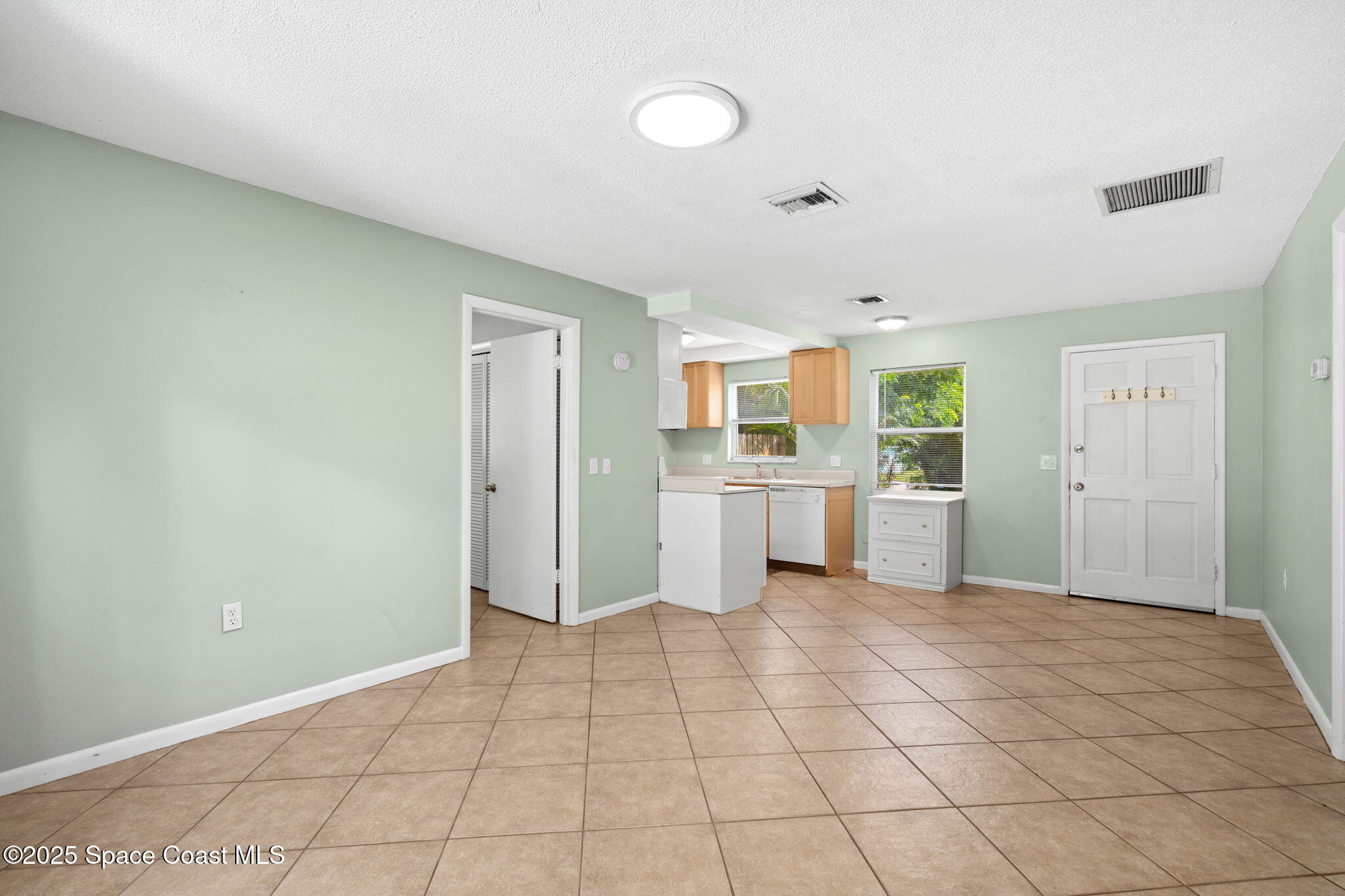 2902 Emory Street Melbourne, FL 32901 - Photo 36 of 46 a view of a kitchen with white cabinets