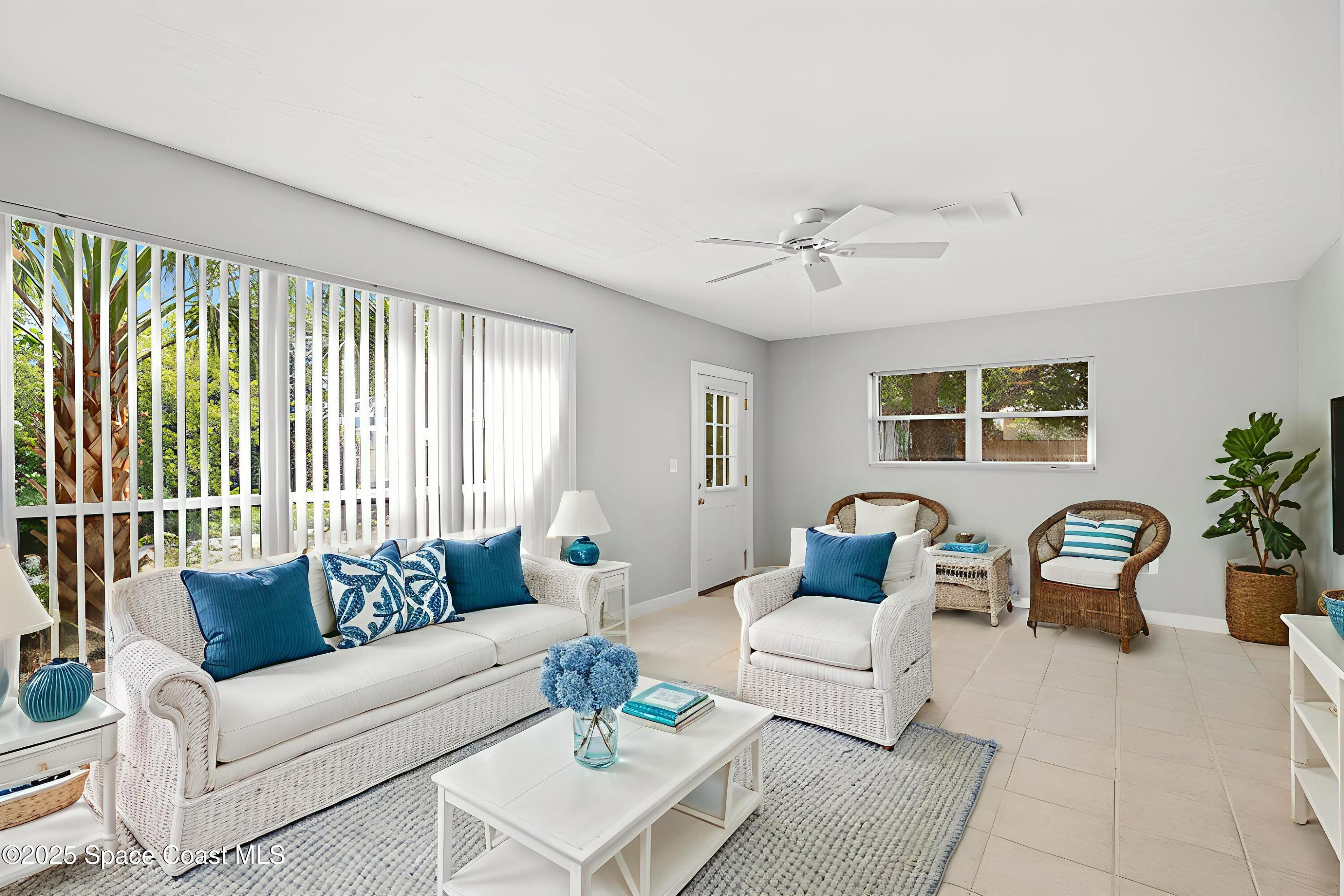2902 Emory Street Melbourne, FL 32901 - Photo 9 of 46 a living room with furniture and a large window