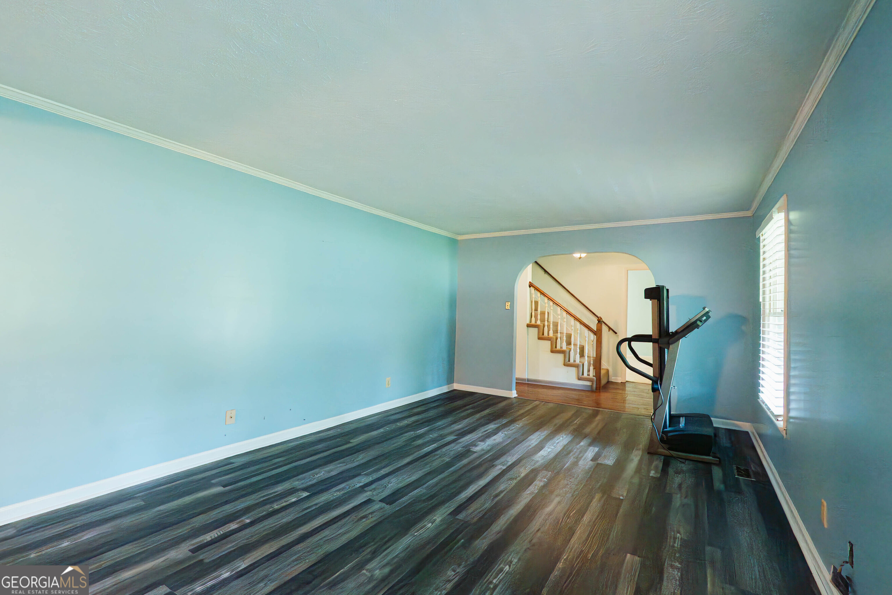 139 Cords Bridge Road Northeast Milledgeville, GA 31061 - Photo 11 of 35 a view of empty room with wooden floor and fan