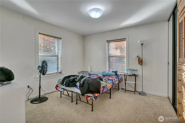 a bed room with furniture and a window